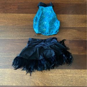 blue top and black feather skirt for competition